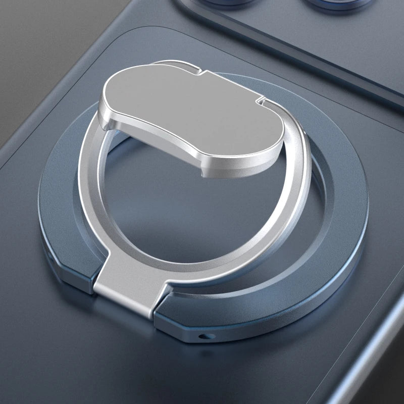 A silver magnetic phone stand with a kickstand is shown on a gray device surface.