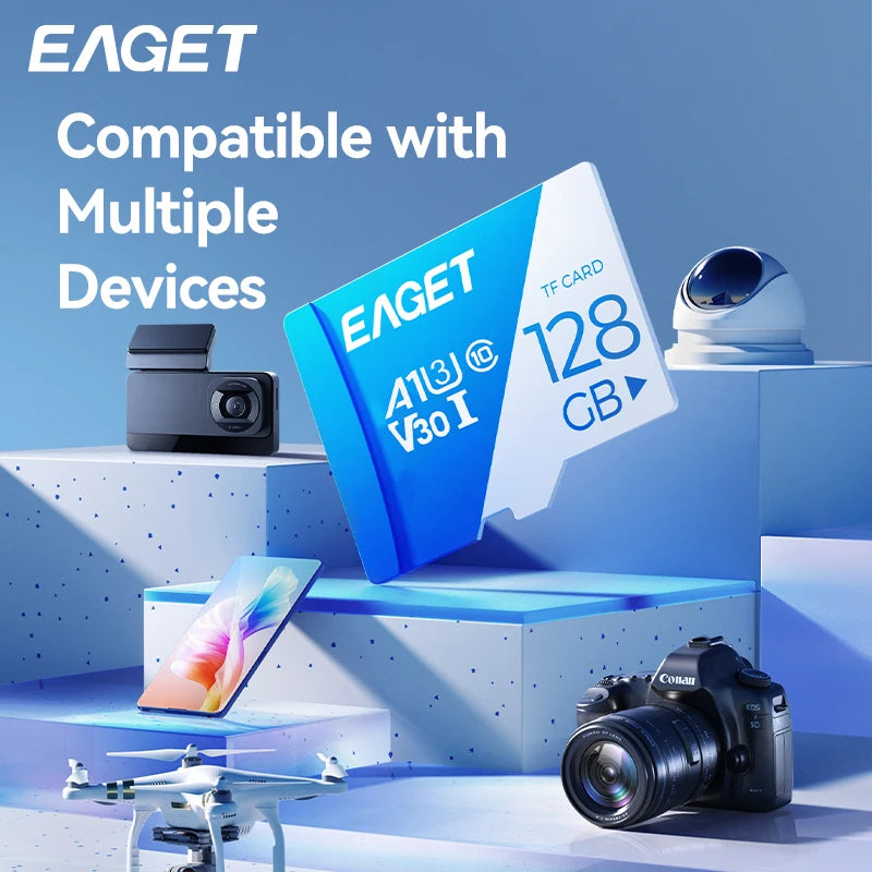 بطاقة زرقاء تحمل علامة EAGET متوافقة مع أجهزة متعددة موضوعة بجوار كاميرا وطائرة بدون طيار على سطح أزرق فاتح.