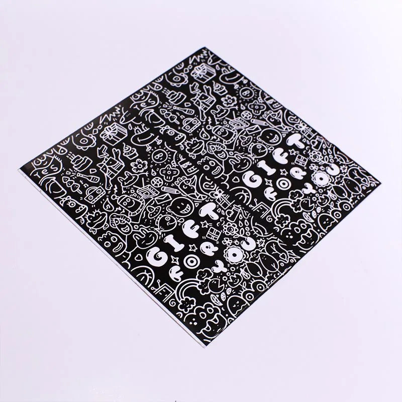 A black and white rectangular sticker sheet featuring various thank you and gift-related doodles.