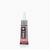 A bottle of B-7000 precision adhesive jewelry glue with a white cap and black label.