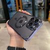 A hand holds a dark purple magnetic clear case with a plated finish for a MagSafe iPhone.