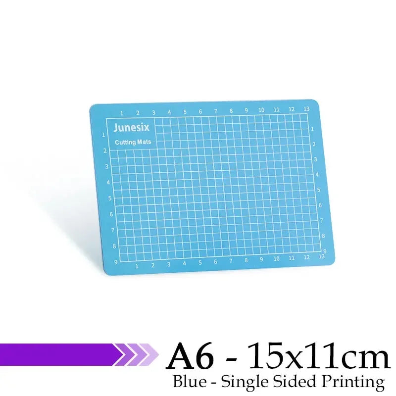 A blue A6 cutting mat with a grid for cutting mats, featuring numbered guides and single-sided printing.