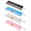A collection of portable manual paper trimmers in black, blue, white, and pink, shown from the side.