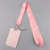 A pink heart-shaped lanyard with a matching tag is displayed against a gray background.