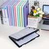 A set of colorful A4 document and photo storage file boxes arranged in a row next to a laptop.