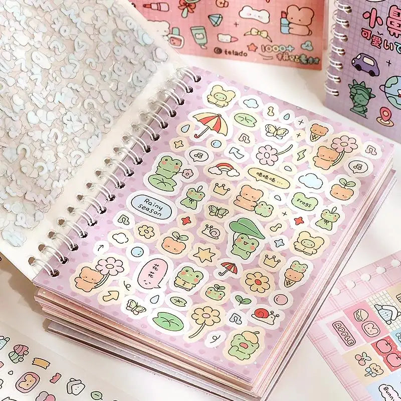 A close-up of a pink cartoon sticker book filled with cute, colorful illustrations for scrapbooking and journaling.