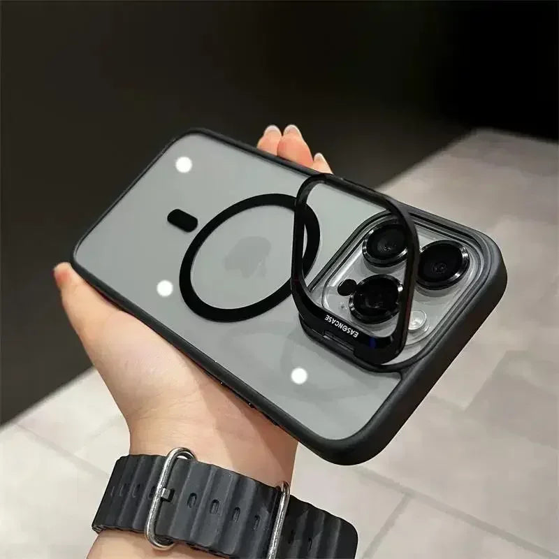 A hand holds a black magnetic shockproof phone case for an iPhone, displaying a camera module.