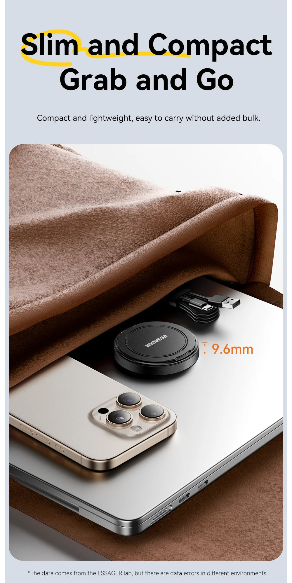 A close-up of a magnetic wireless charger with a stand placed on a laptop next to an iPhone.