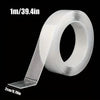 Roll of 1m/39.4in heavy duty double-sided transparent mounting tape shown flat.