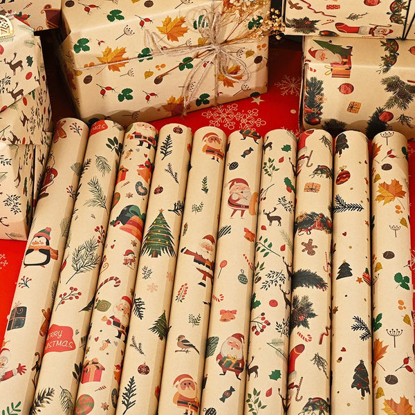 A set of Merry Christmas wrapping paper featuring Santa and tree designs on rolled paper.