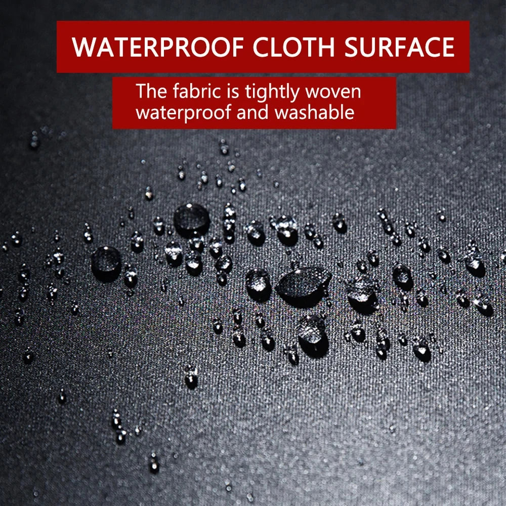 Close-up of a dark fabric surface showing water droplets, highlighting its waterproof and washable properties.