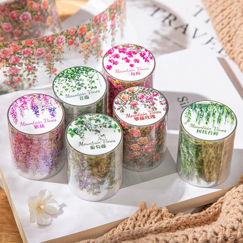A collection of floral vine transparent PET washi tape in various shades and colors displayed on a white background.