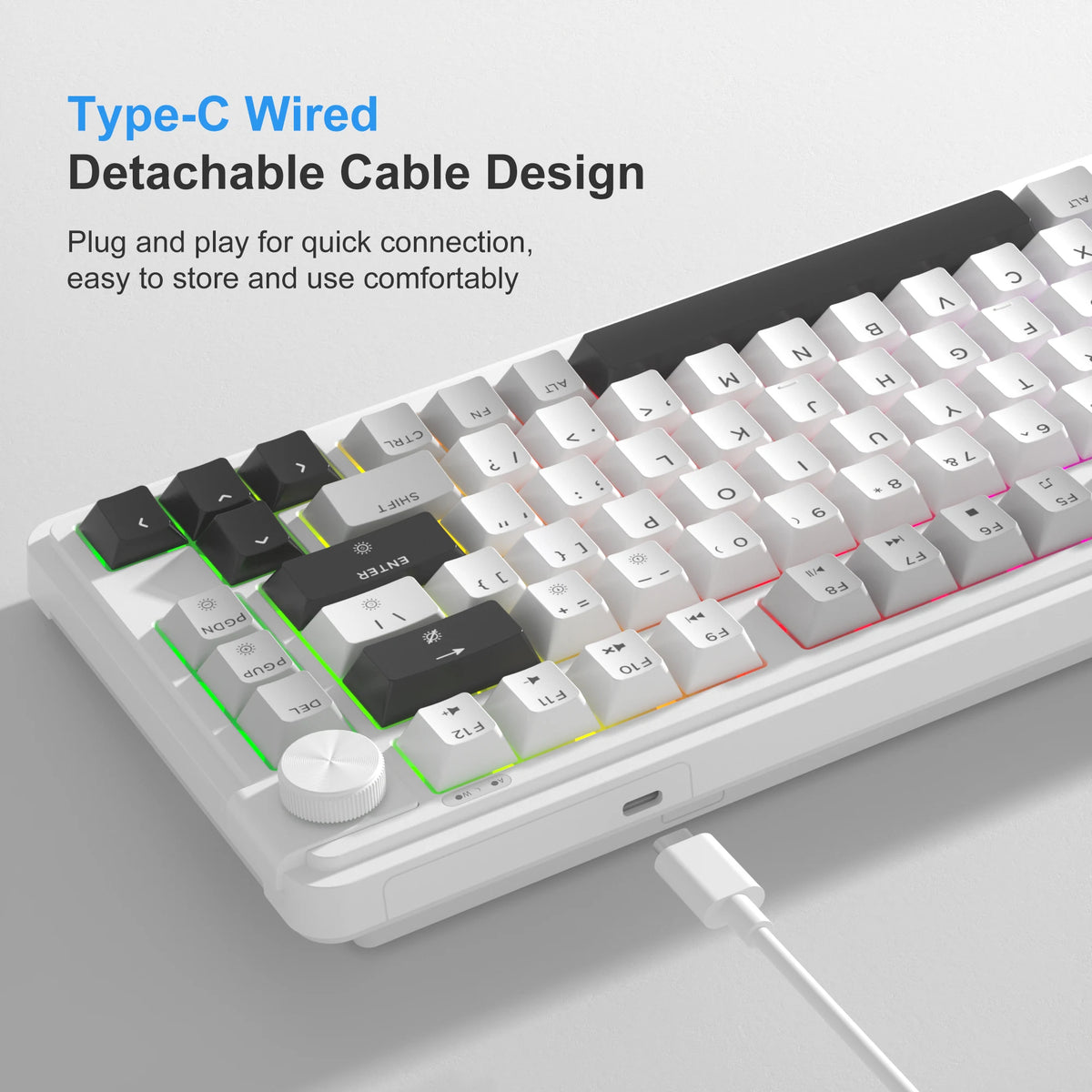Teclado compacto de membrana blanco con cable desmontable negro y perilla giratoria.