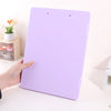 A purple A4 document and photo storage file box is shown being held by a hand on a white surface.