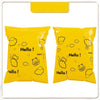 A yellow reusable plastic mailing bag filled with cute cloud and bear illustrations.