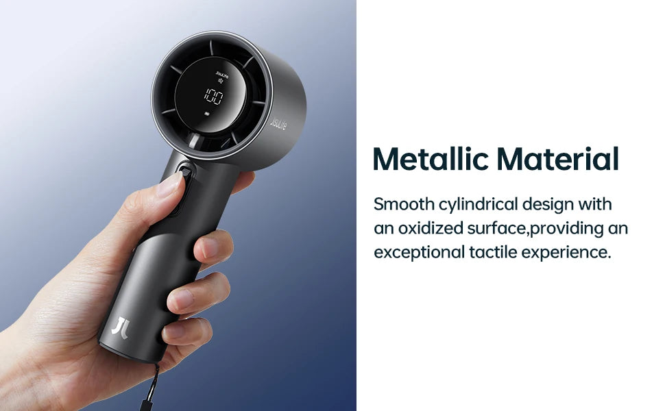 A hand holds a matte black handheld fan with an oxidized metallic finish and an LED display.