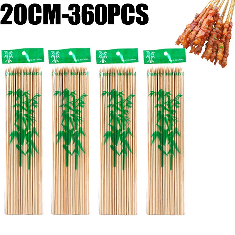 A set of natural bamboo skewers with green tips, packaged for cooking or grilling.