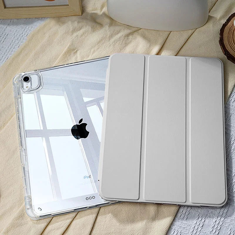 A white universal protective case for an Apple iPad is shown resting on a light fabric surface.