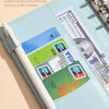 A light blue reusable PU leather binder showing various cards and bills stored in multiple pockets.