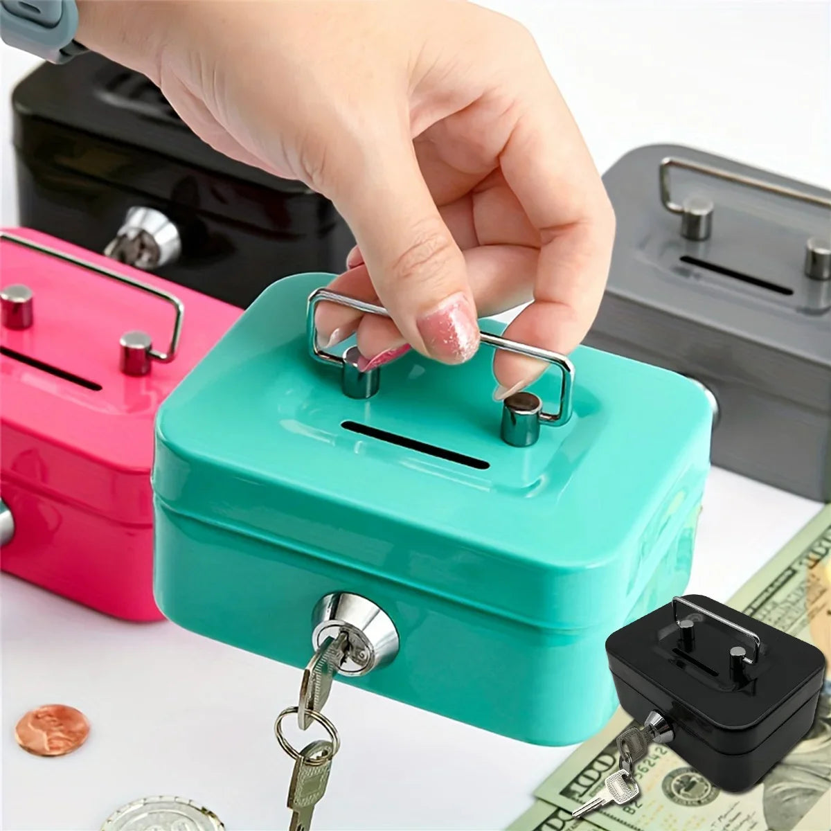 A hand is opening a teal steel cash box with a key lock and removable tray, next to some money.