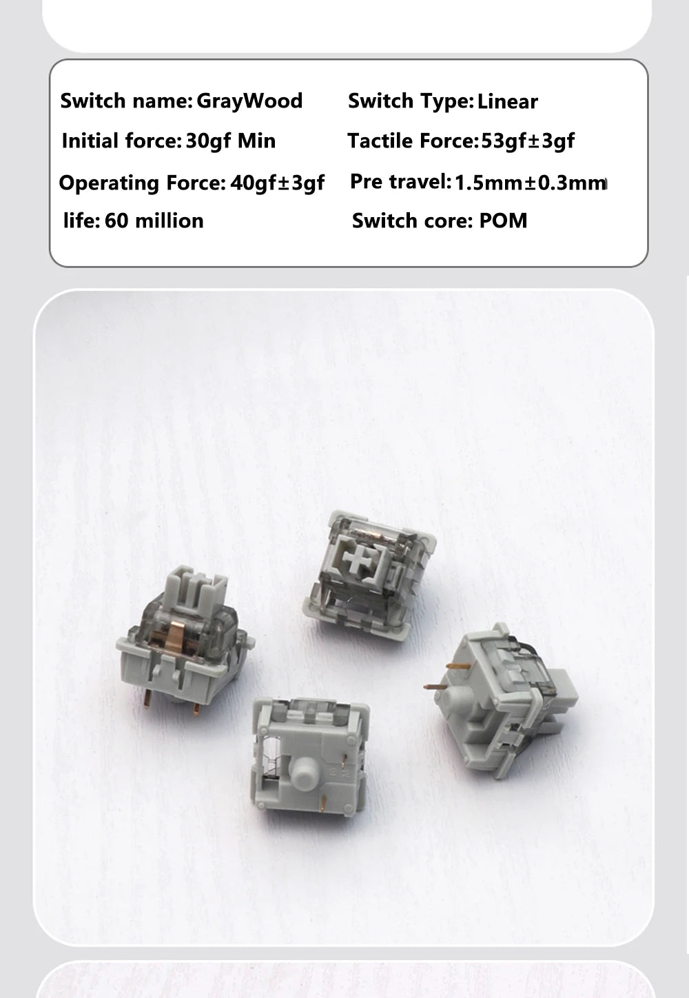 Three gray mechanical keyboard switches are shown on a white surface.