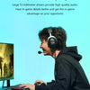 A person wearing a black hoodie and headphones is playing a game on a computer, demonstrating high-quality audio.