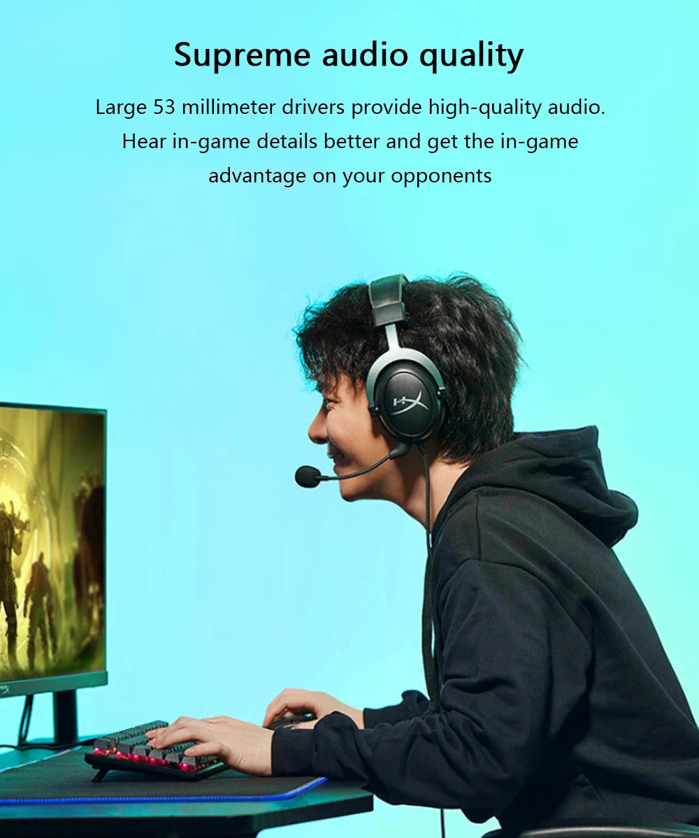 A person wearing a black hoodie and headphones is playing a game on a computer, demonstrating high-quality audio.