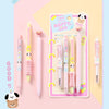 A set of four cute heart-shaped gel pens featuring various animal patterns and colors displayed on a pink background.