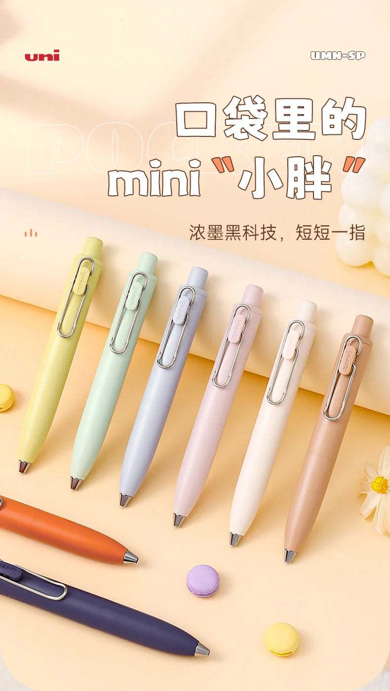 A collection of various colored Uni-Ball One Mini Cute Gel Pens displayed on a light background.