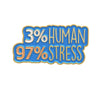 A blue enamel pin featuring the text 3% HUMAN 97% STRESS in gold and blue lettering.
