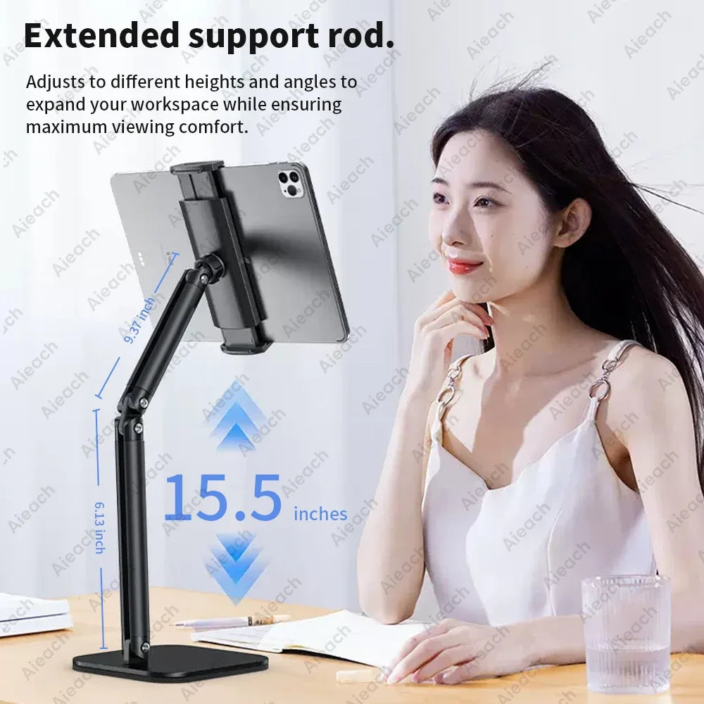A woman is using an extended support rod tablet stand to adjust the viewing angle for comfortable work.