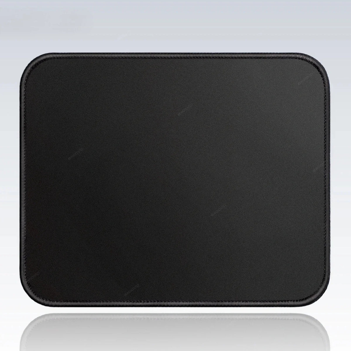 Black portable gaming mouse pad with a stitched edge shown on a reflective surface.