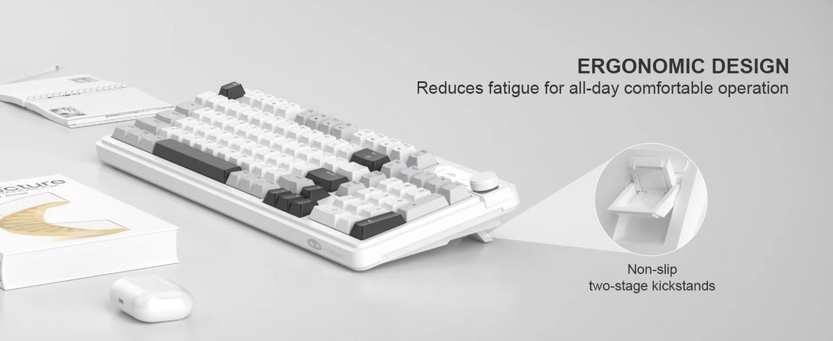 A white membrane keyboard with gray and black keys is shown next to a mouse, illustrating ergonomic design features.