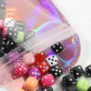 A close-up view of a 50 pack of iridescent self-sealing jewelry pouches with various colored and patterned dice inside.