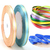 Rolls of gold edge satin ribbon in various colors including teal and yellow