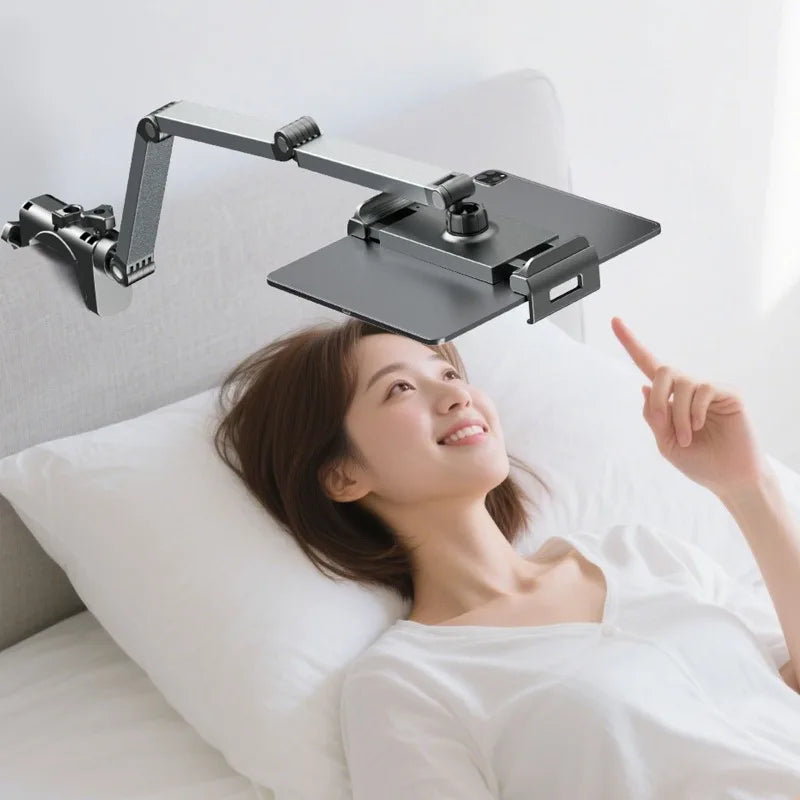 A woman is using an adjustable aluminum tablet stand with a clamp to point at something.