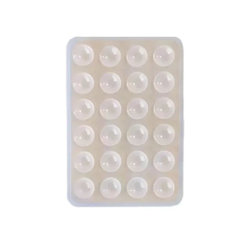 A clear plastic tray containing 24 silicone suction cups for mounting phones and tablets.
