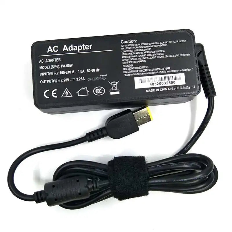 Black AC adapter for a laptop, featuring input/output specifications and a power cord.