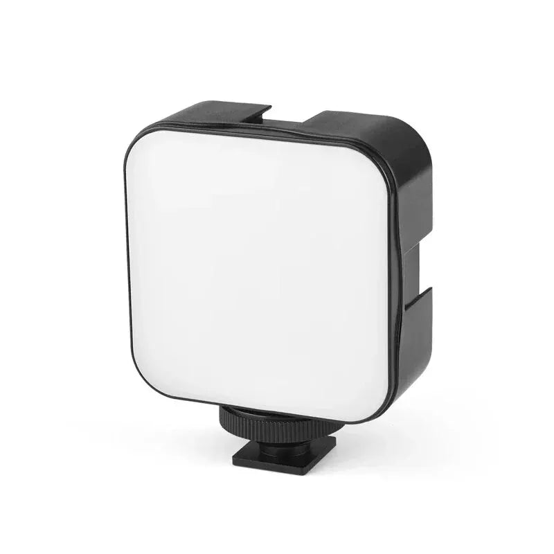 Black mini clip-on LED fill light with a square white light panel and adjustable mount.