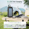 A black solar power bank is shown charging an iPhone 15 outdoors on a wooden table.