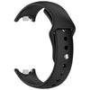 A black silicone replacement strap for a Mi Band watch, shown in a curved form.