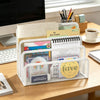 A white metal mesh desk file organizer holding various planners and stationery items.