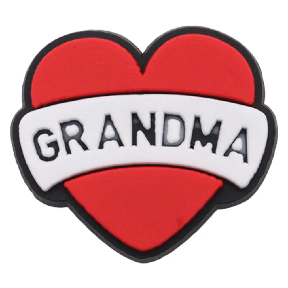A heart-shaped enamel pin featuring the word GRANDMA in white text on a red background.