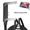 A black USB A to Type C 65W fast charging cable with an integrated stand for charging and data transfer.