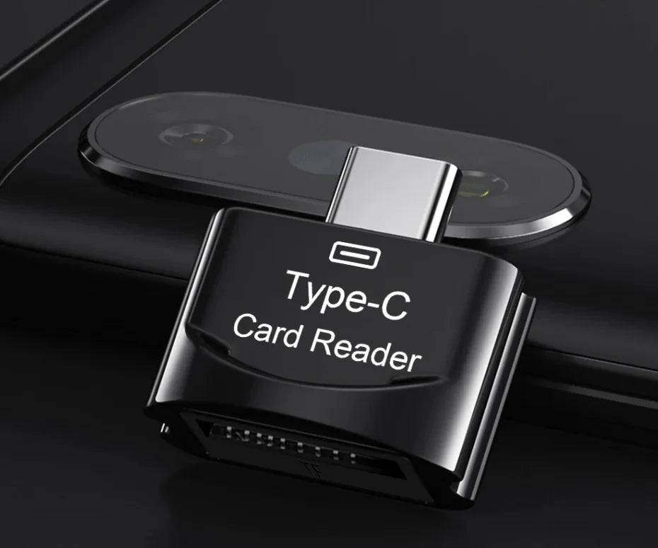 A black Type-C card reader device is shown resting on a dark surface next to a smartphone module.