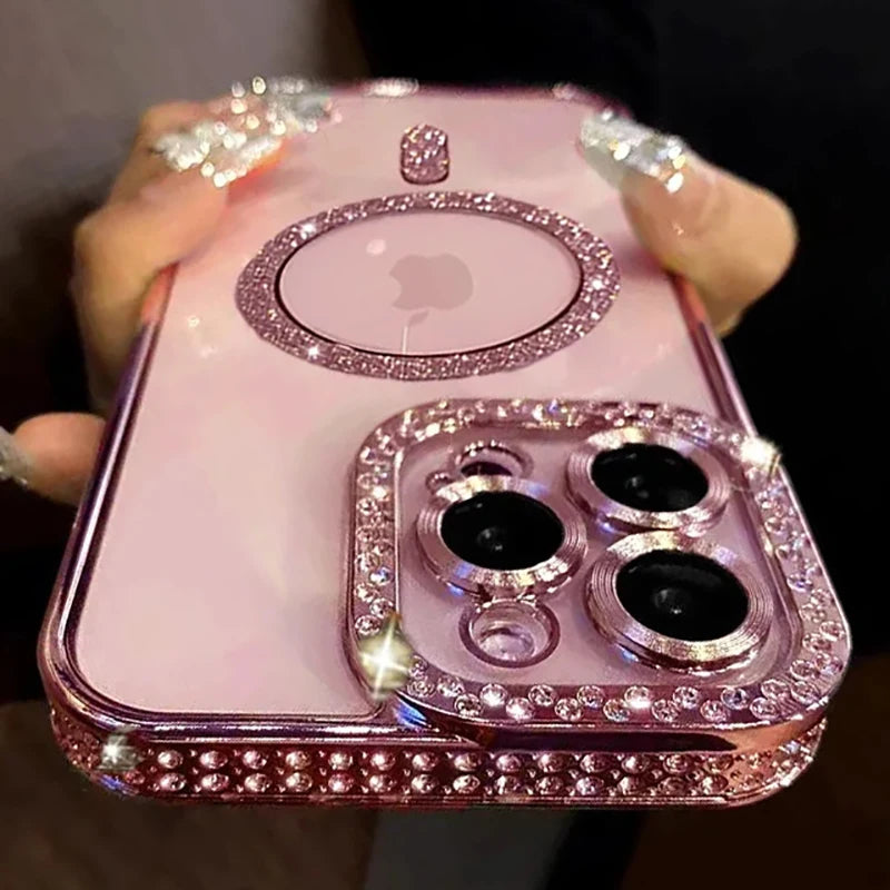 A pink glitter diamond magnetic wireless phone case is held in a hand against a dark background.