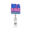 A purple glitter acrylic badge holder with the text BE A KIND HUMAN on it.