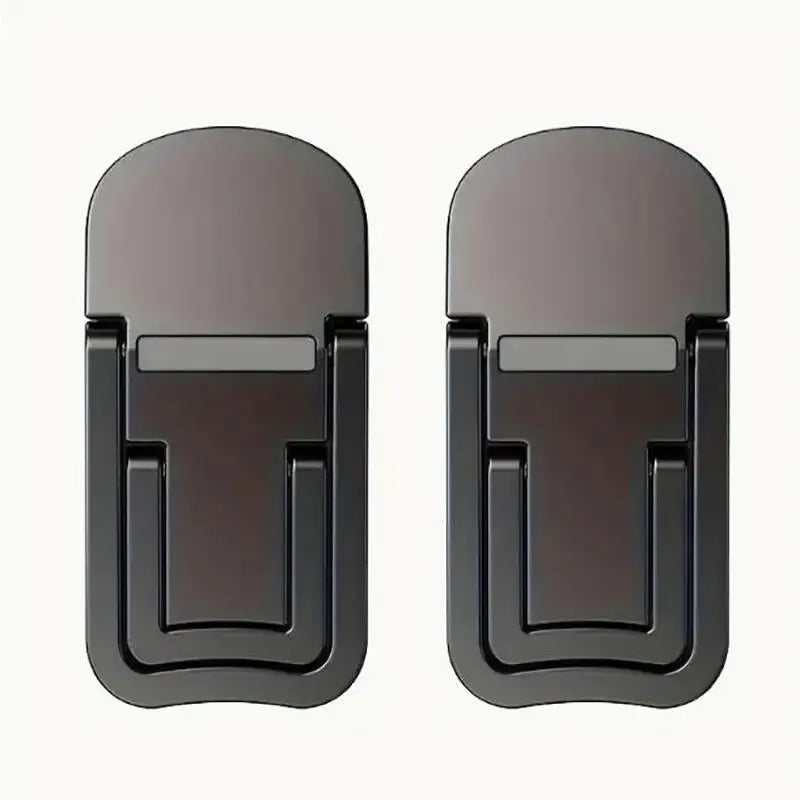 A pair of dark gray foldable laptop and tablet stands or risers.