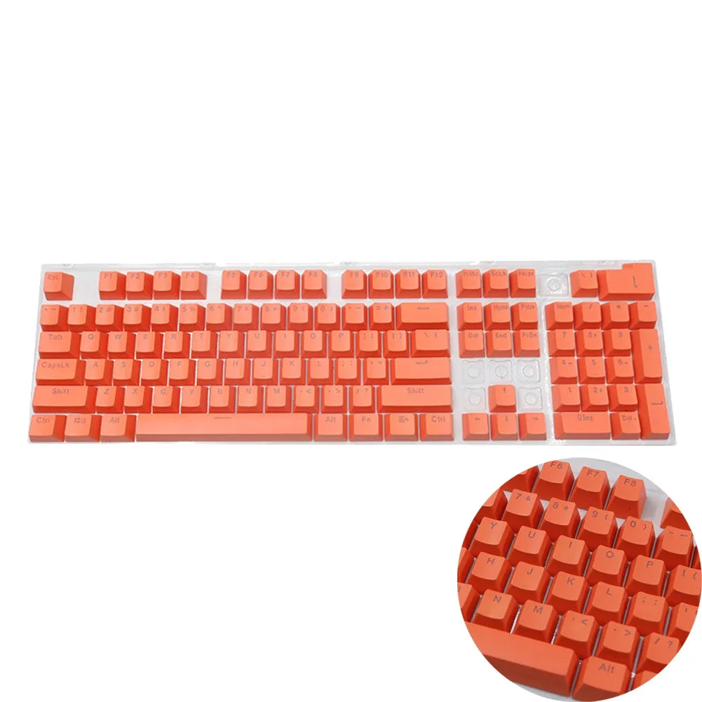 A set of orange mechanical keyboard keycaps for a 104-key keyboard.