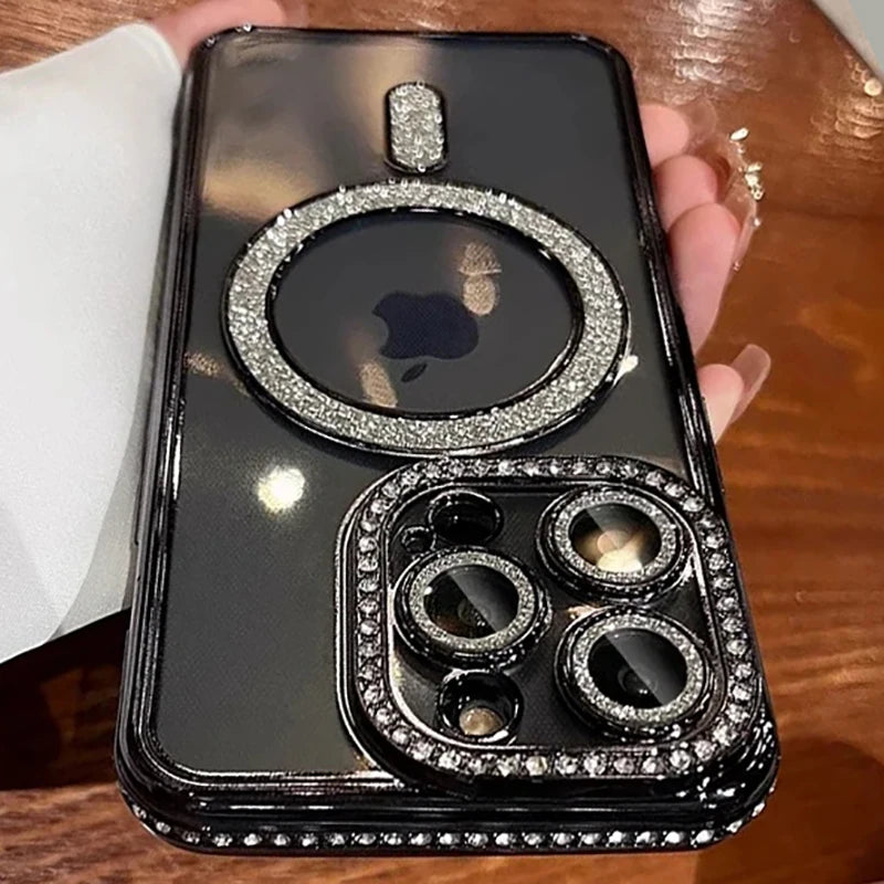A black glitter diamond magnetic wireless phone case is shown in a hand holding it against a wooden background.